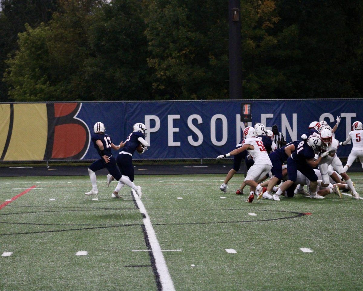 #13 Griffen Mauer hands off the ball to #23 Rory Kvern.