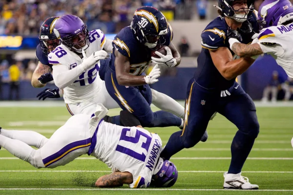 Chargers running back Kimani Vidal carries the ball during the first half of a 37-10 win over the Minnesota Vikings at SoFi Stadium on Thursday night. Vidal rushed for 117 yards and a touchdown. 