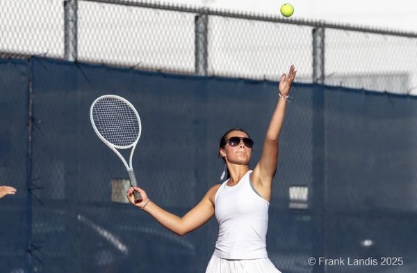 Senior Lauren Elam winds up to serve against Chaska during a match on September 25.