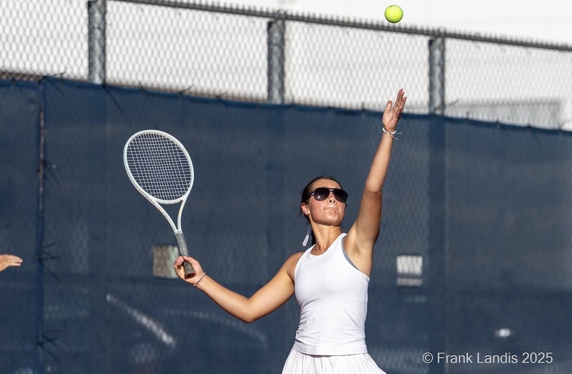 Senior Lauren Elam winds up to serve against Chaska during a match on September 25.