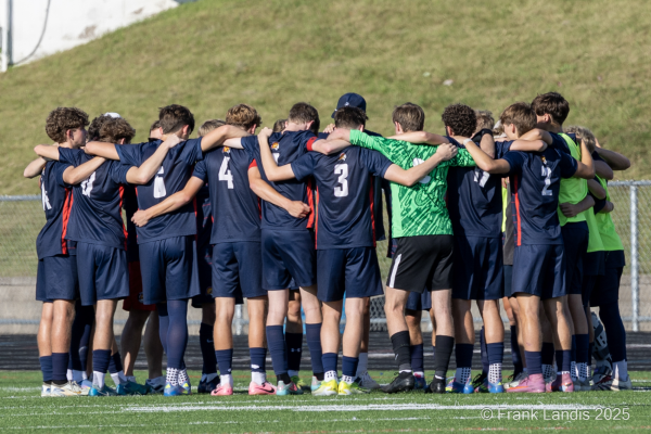 The Orono Boys Soccer Team huddles before a game.