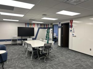 The interior of the new College & Career Center, featuring counselor offices on the side walls and flags from college visits.