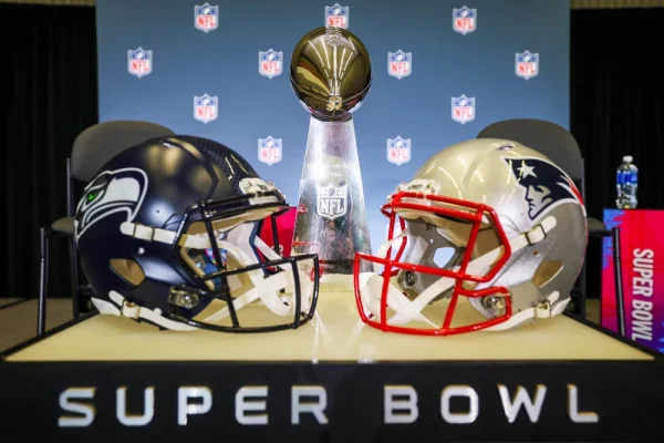The Seattle Seahawks and New England Patriots helmets are displayed with the Vince Lombardi Trophy before a press conference for NFL commissioner Roger Goodell at the San Jose Convention Center.